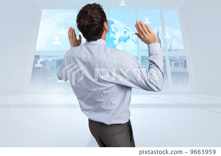 Composite image of businessman standing with arms pushing up 9663959