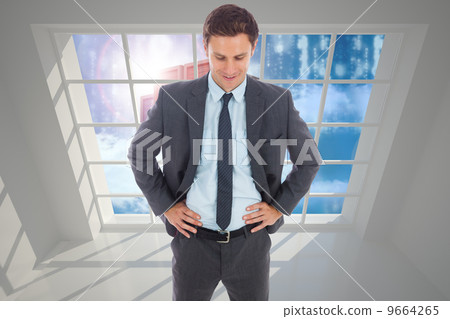 Composite image of cheerful businessman standing with hands on h Composite image of cheerful businessman standing with hands on h 9664265