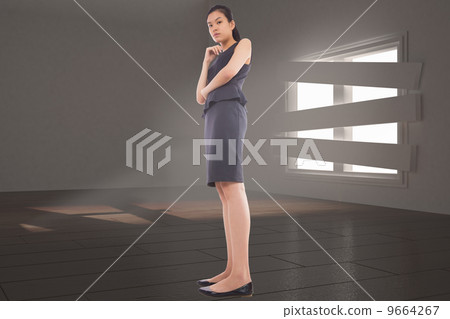 Composite image of thinking asian businesswoman 9664267