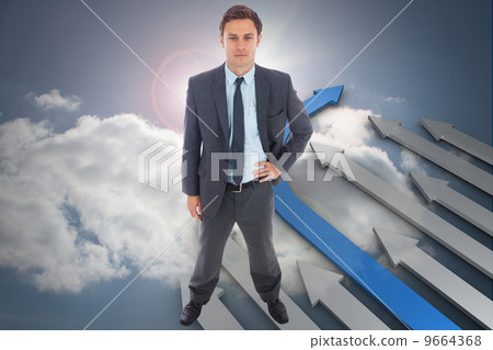 Composite image of stern businessman standing with hand on hip Composite image of stern businessman standing with hand on hip 9664368