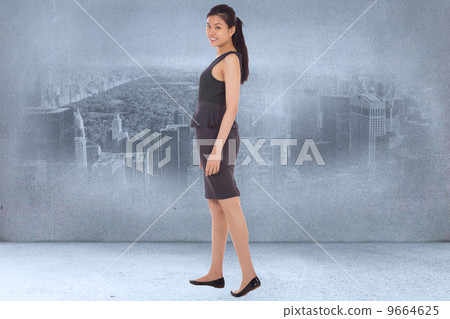 Composite image of asian businesswoman walking Composite image of asian businesswoman walking 9664625