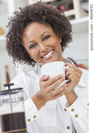 Mixed Race African American Girl Drinking Coffee 9664695