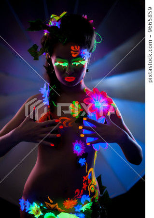 Naked woman with makeup, glowing under UV light 9665859