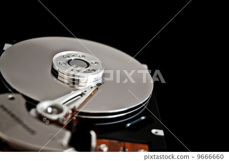 Open hard disk on a black background 9666660