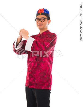 Asian man with Chinese traditional dress cheongsam and gong xi f 9668361