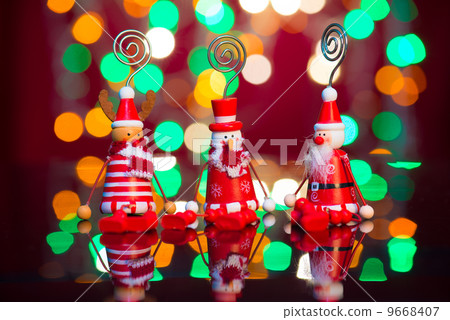 christmas elves, santa and snowman toy with lights background 9668407