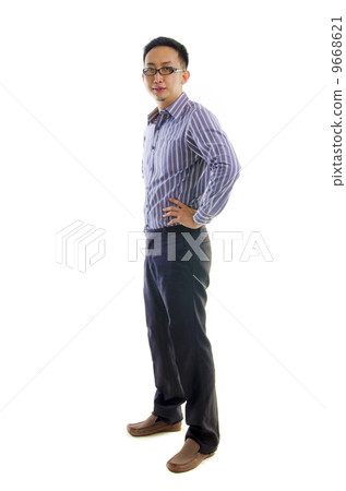 Full body of a smiling young Asian executive standing against is Full body of a smiling young Asian executive standing against is 9668621