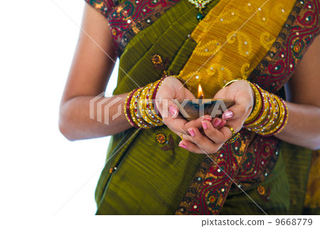 traditional indian female with oil lamp during the celebration o 9668779