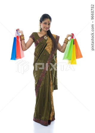 traditional indian woman doing diwali shopping with isolated whi 9668782