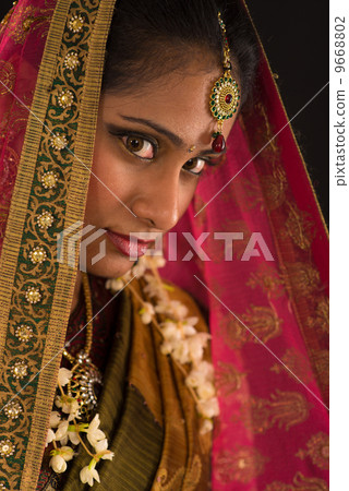 young south Indian woman in traditional sari dress young south Indian woman in traditional sari dress 9668802