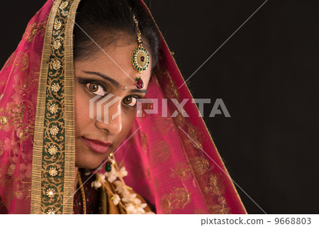 young south Indian woman in traditional sari dress 9668803