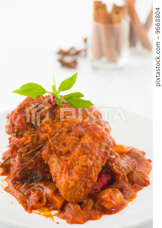 curry chicken, indian cuisine with traditional food items on bac 9668804
