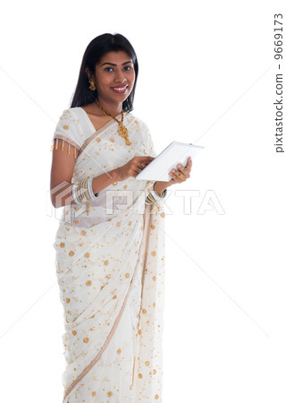 traditional indian female woman surfing a tablet computer 9669173