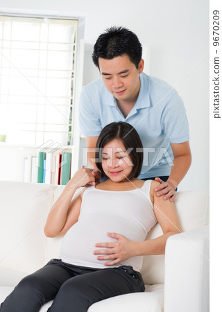 asian pregnant mother and her husband asian pregnant mother and her husband 9670209