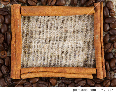 Cinnamon sticks frame on a sacking cloth 9670776