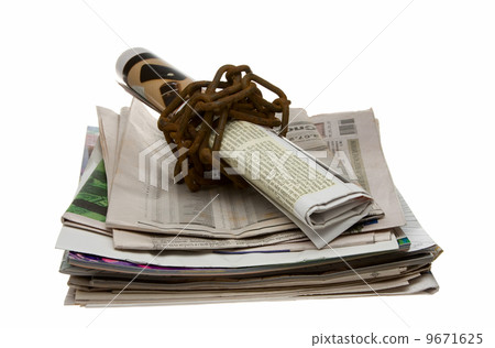 Newspaper secured by old chain - freedom of speech concept 9671625