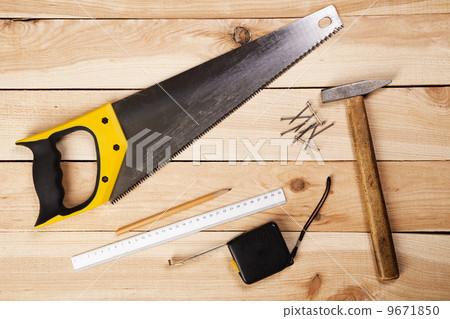 Carpenter's tools on pine desks 9671850