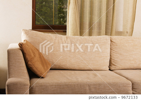 Beige comfortable sofa in home interior Beige comfortable sofa in home interior 9672133