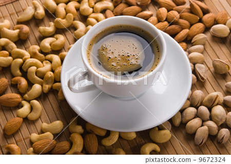 Coffee with nuts on background 9672324