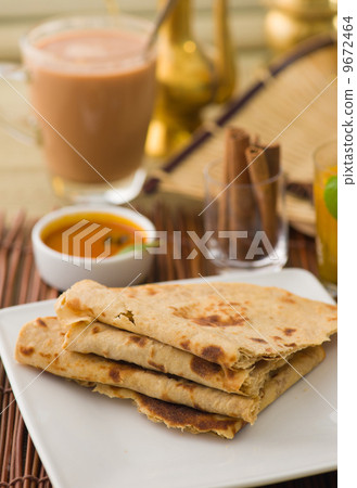 Chapati , Indian flat bread in plate usually served with curry Chapati , Indian flat bread in plate usually served with curry 9672464