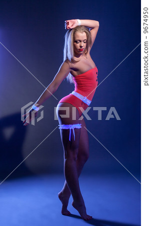 Sensual girl dancing in glowing costume Sensual girl dancing in glowing costume 9674950