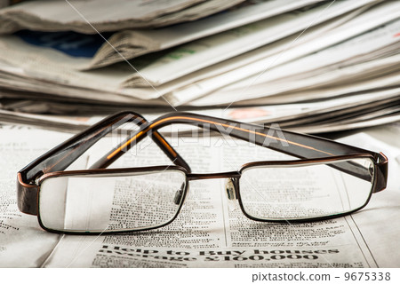 Glasses on newspaper Glasses on newspaper 9675338