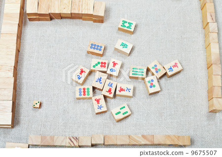playing mahjong board game on textile table playing mahjong board game on textile table 9675507
