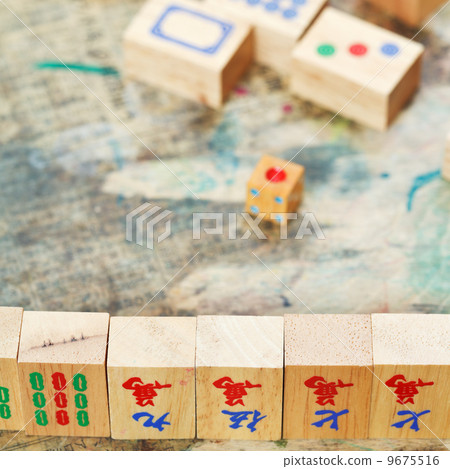 mahjong wood tiles close up and playing field 9675516
