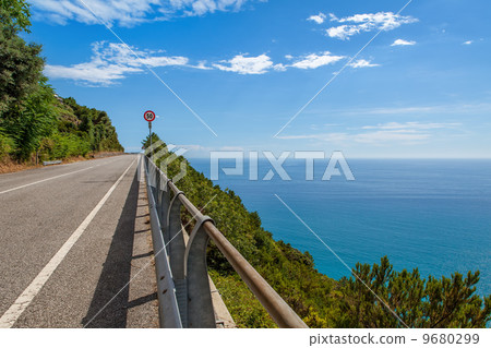 Road along Mediterranean sea coastline in Italy. 9680299