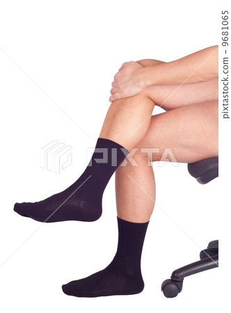 Male legs in black socks. Isolated on white Male legs in black socks. Isolated on white 9681065