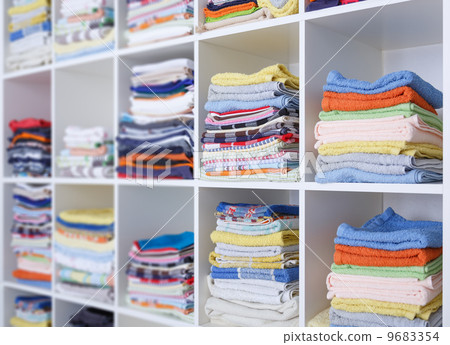 towels, bed sheets and clothes on the shelf towels, bed sheets and clothes on the shelf 9683354