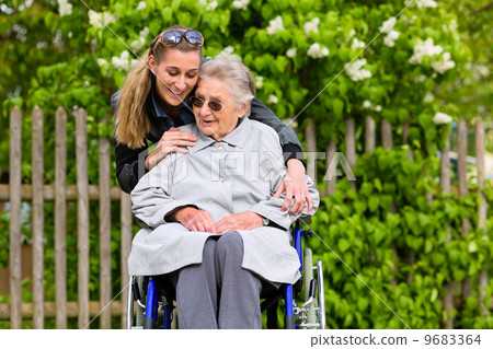 Young woman is visiting her grandmother in nursing home Young woman is visiting her grandmother in nursing home 9683364