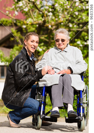 woman visiting grandmother in nursing home woman visiting grandmother in nursing home 9683366