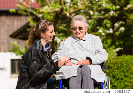 woman visiting grandmother in nursing home woman visiting grandmother in nursing home 9683367