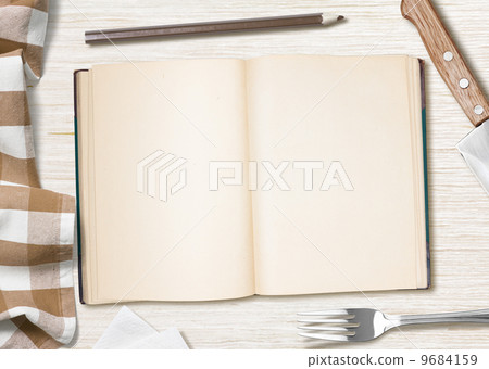 blank cooking recipe notes or book  with pencil on kitchen table 9684159
