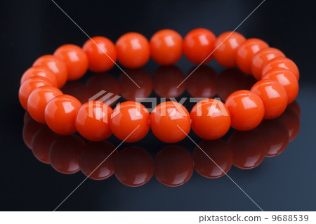 red bracelet on a black background 9688539