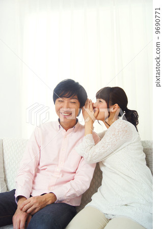 A couple talking secretly A couple talking secretly 9690771