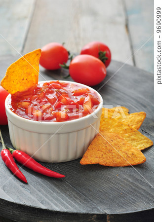 Bowl of salsa with tortilla chips 9690999