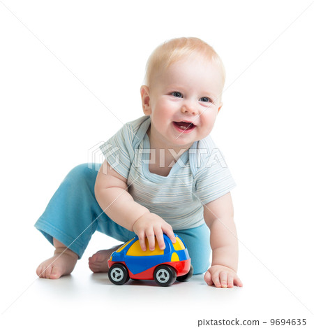 smiling kid playing with toy smiling kid playing with toy 9694635