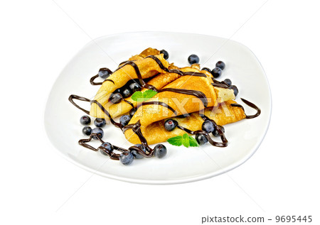 Pancakes with blueberries and chocolate in a plate Pancakes with blueberries and chocolate in a plate 9695445