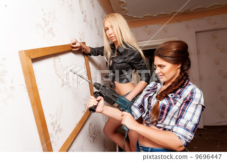 Attractive women with puncher and frame Attractive women with puncher and frame 9696447