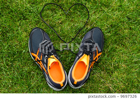 Sneakers on grass with heart Sneakers on grass with heart 9697326