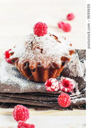 Fruitcake Decorated by Raspberry and icing sugar 9699689