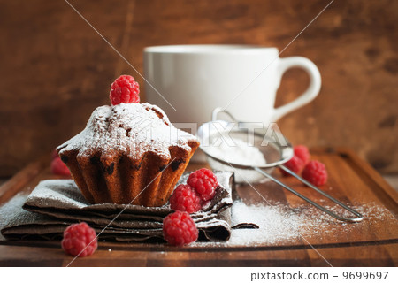 Fruitcake Decorated with Raspberry and icing sugar Fruitcake Decorated with Raspberry and icing sugar 9699697