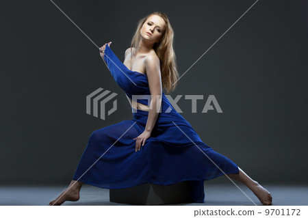 Languid nude girl posing with cloth in studio 9701172