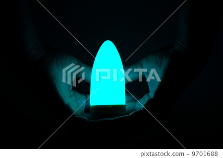 hand security luminous bulb on black background hand security luminous bulb on black background 9701688