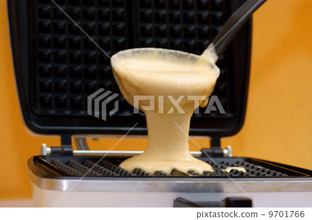 waffle pastry press in use in modern kitchen waffle pastry press in use in modern kitchen 9701766