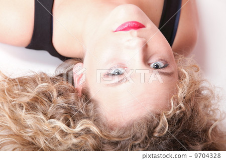 beautiful long blond curly hair of young attractive woman 9704328