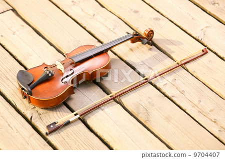 Violin on wooden pier. Music concept Violin on wooden pier. Music concept 9704407