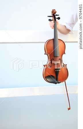 Female hand with a violin outdoor 9704481